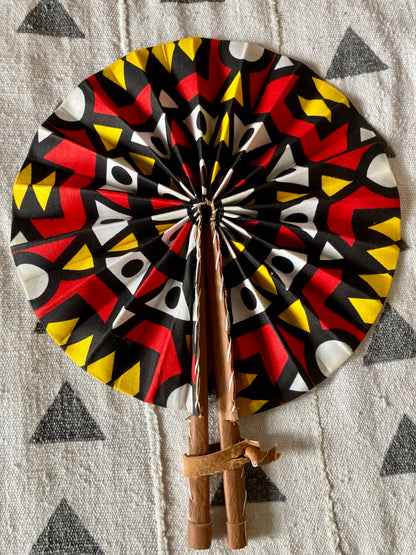 Fan- Collapses for easy storage, made from African wax fabric